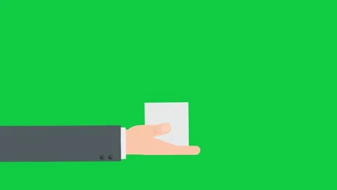 Hand holding a square object, demonstrating offering on green screen. Stock Footage 299045961