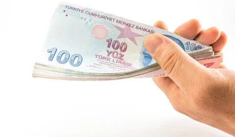 Hand Holding Stack of 100 Turkish Lira Banknotes Stock Photos