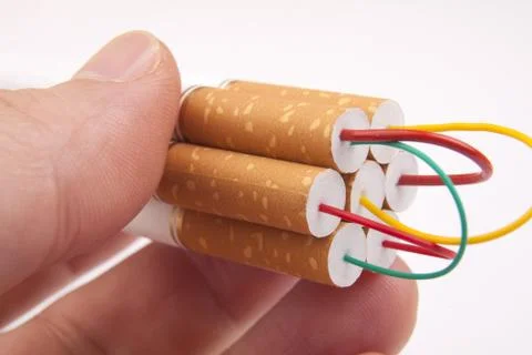 Hand holding stack of Cigarettes Stock Photos