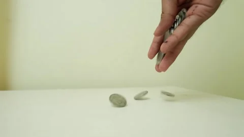 Hand Holding Stack of Coins Above Surface Stock Footage 317737398