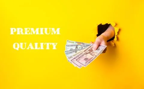 Hand is holding a stack of five dollar bills Stock Photos