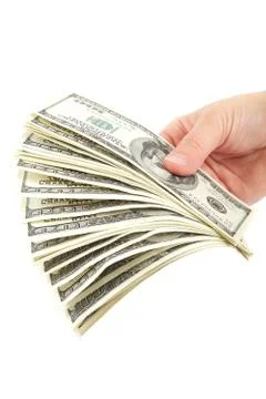 Hand holding a stack of money isolated on white background. Stock Photos