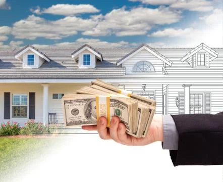 Hand Holding Stack of Money Over House Drawing Gradating Into Photograph. Stock Photos