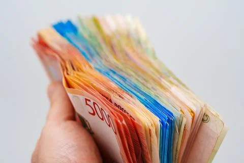 Hand holding a stack of Russian rubles showing wealth management and financ.. Stock Photos