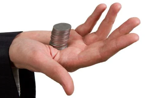 Hand holding a stack of silver coins on white Stock Photos