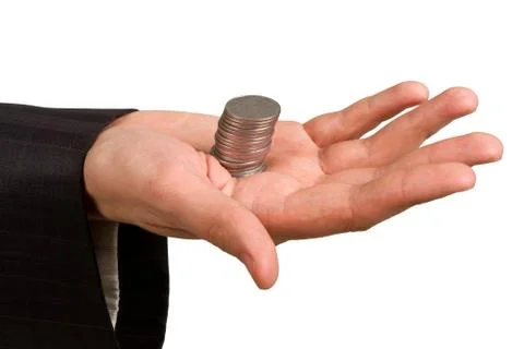 Hand holding a stack of silver coins Stock Photos