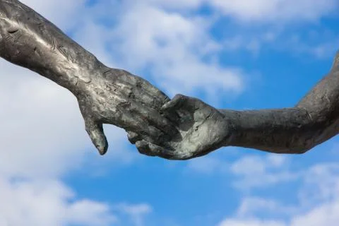 Hand holding statues Stock Photos