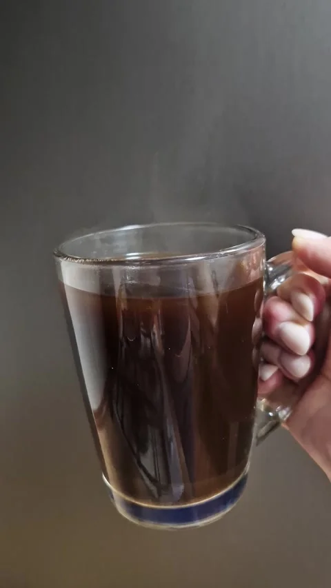 Hand Holding Steaming Coffee Mug with Vapor Stock Footage 318801706