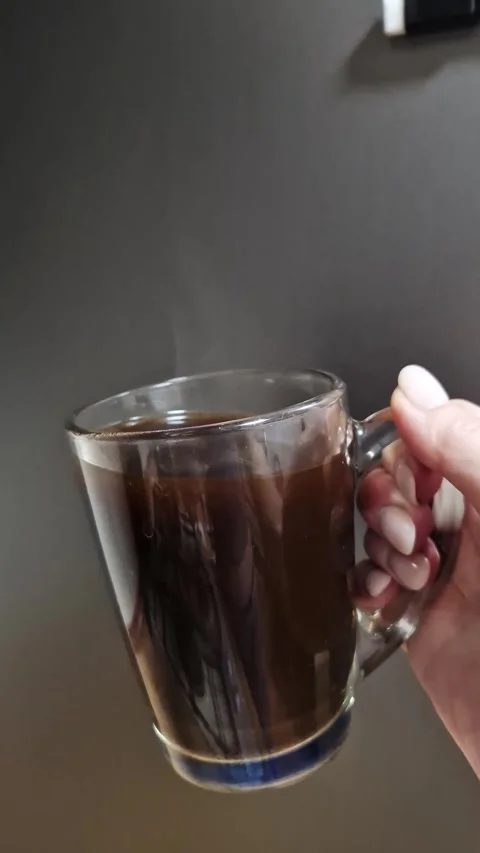 Hand Holding Steaming Coffee Mug Dark Background Stock-Footage 318801876