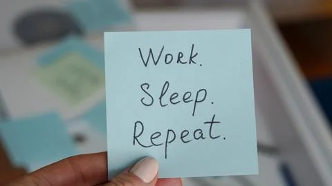 Hand holding sticky note with text about work-life balance concept Stock Photos