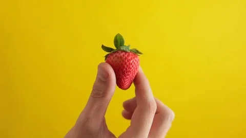 Hand Holding Strawberry Stock Footage 95210338