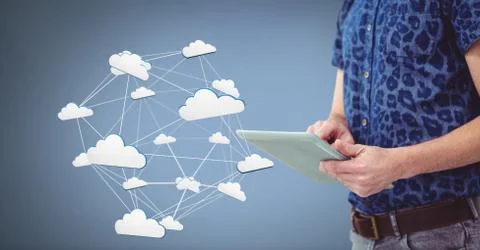 Hand holding tablet with 3D cloud icons 写真素材