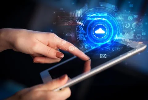 Hand holding tablet with cloud system concept Stockfoto's