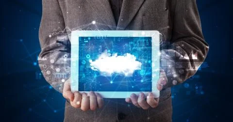 Hand holding tablet with cloud technology concept Foto stock