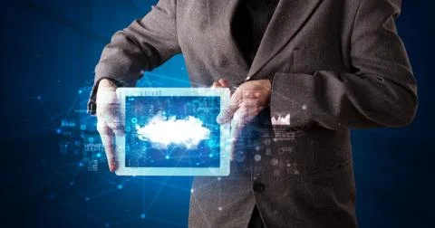 Hand holding tablet with cloud technology concept Foto stock