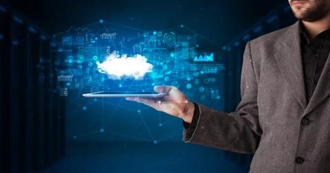 Hand holding tablet with cloud technology concept Stockfoto's