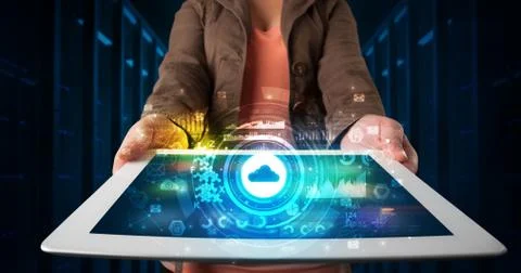 Hand holding tablet with cloud technology concept 写真素材