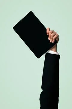 Hand holding tablet device on isolated background. Quaint Stock Photos