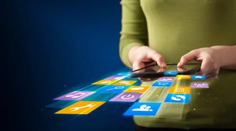 Hand holding tablet device with media application 스톡 사진