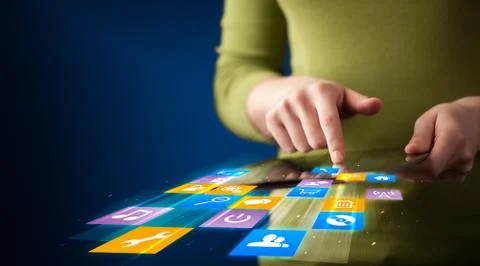 Hand holding tablet device with media application Stock Photos