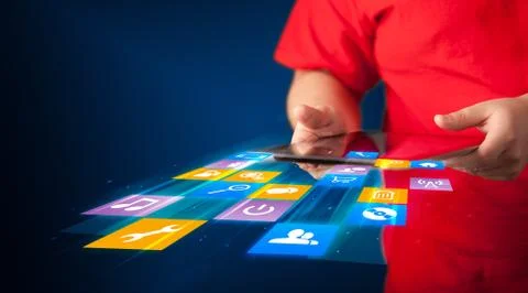 Hand holding tablet device with media application 스톡 사진