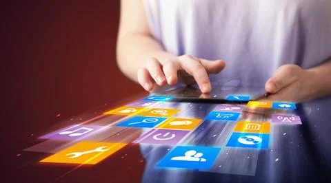 Hand holding tablet device with media application 스톡 사진