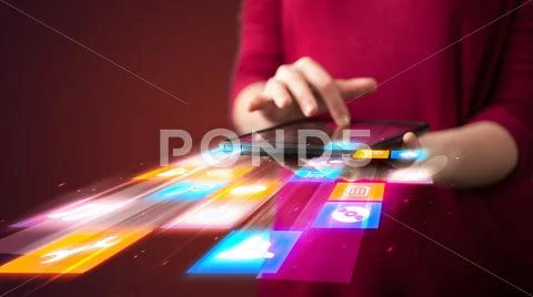 Hand holding tablet device with media application Stock Photos