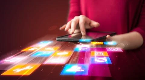 Hand holding tablet device with media application Stock Photos