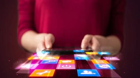 Hand holding tablet device with media application 스톡 사진