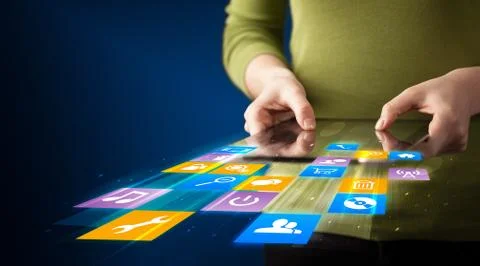 Hand holding tablet device with media application Stock Photos