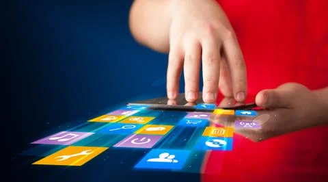 Hand holding tablet device with media application Stock Photos