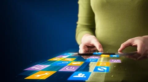Hand holding tablet device with media application 스톡 사진