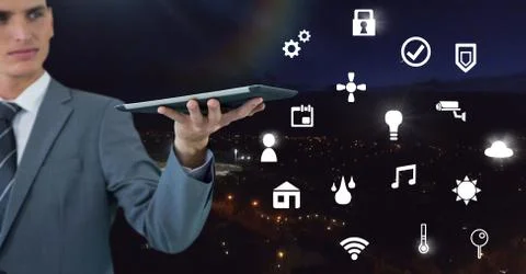 Hand holding tablet with icons interface of internet of things Stock Photos