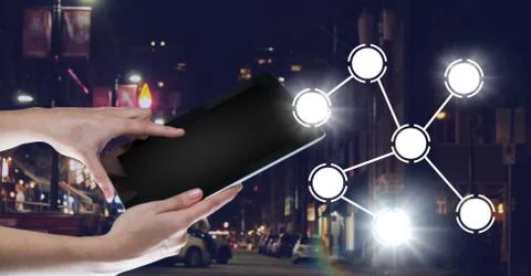 Hand holding tablet with icons interface of internet of things Stock Photos