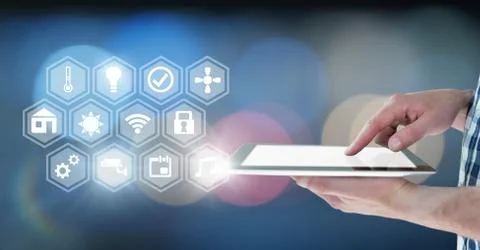 Hand holding tablet with icons interface of internet of things Stock Photos