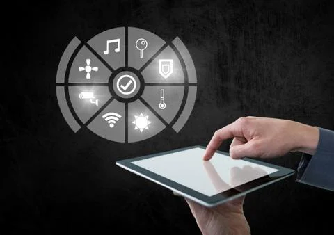 Hand holding tablet with icons interface of internet of things Foto stock