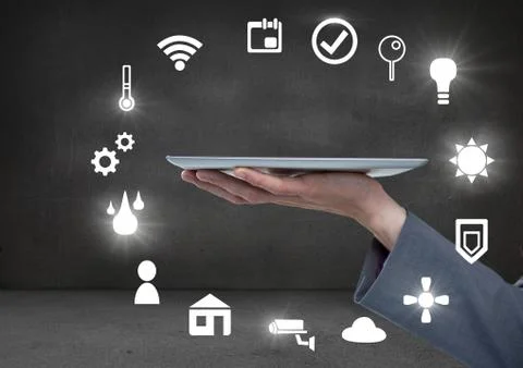 Hand holding tablet with icons interface of internet of things Stock Photos