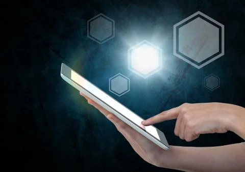 Hand holding tablet with icons interface of internet of things Stock Photos