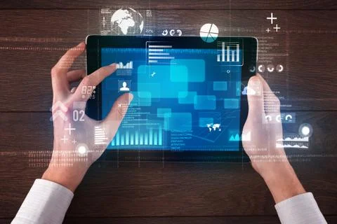 Hand holding tablet Stockfoto's