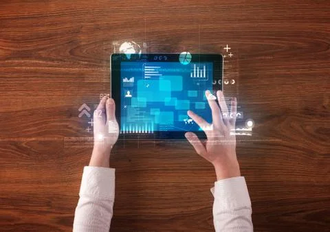 Hand holding tablet Stock Photos