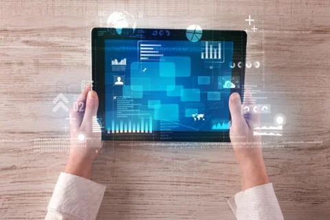 Hand holding tablet Stock Photos