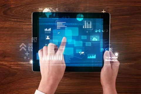 Hand holding tablet Stock Photos