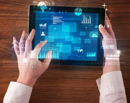Hand holding tablet Stock Photos