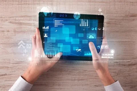 Hand holding tablet Stockfoto's