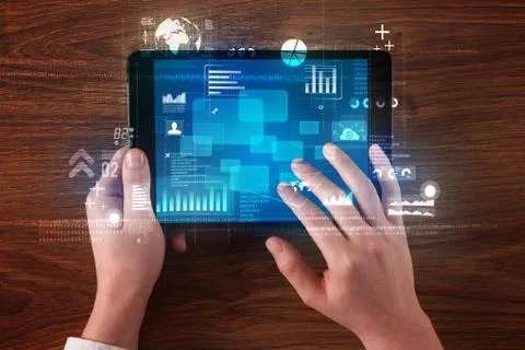 Hand holding tablet Stock Photos