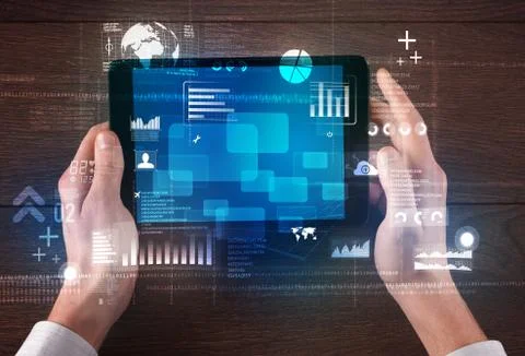 Hand holding tablet Stock Photos