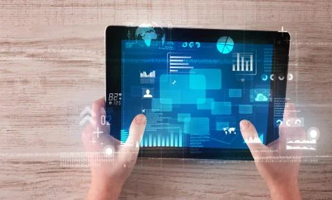 Hand holding tablet Stock Photos