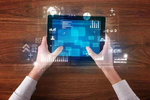 Hand holding tablet Stock Photos