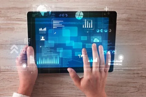 Hand holding tablet Stock Photos