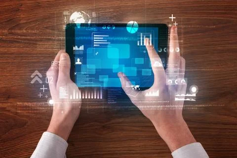 Hand holding tablet Stock Photos